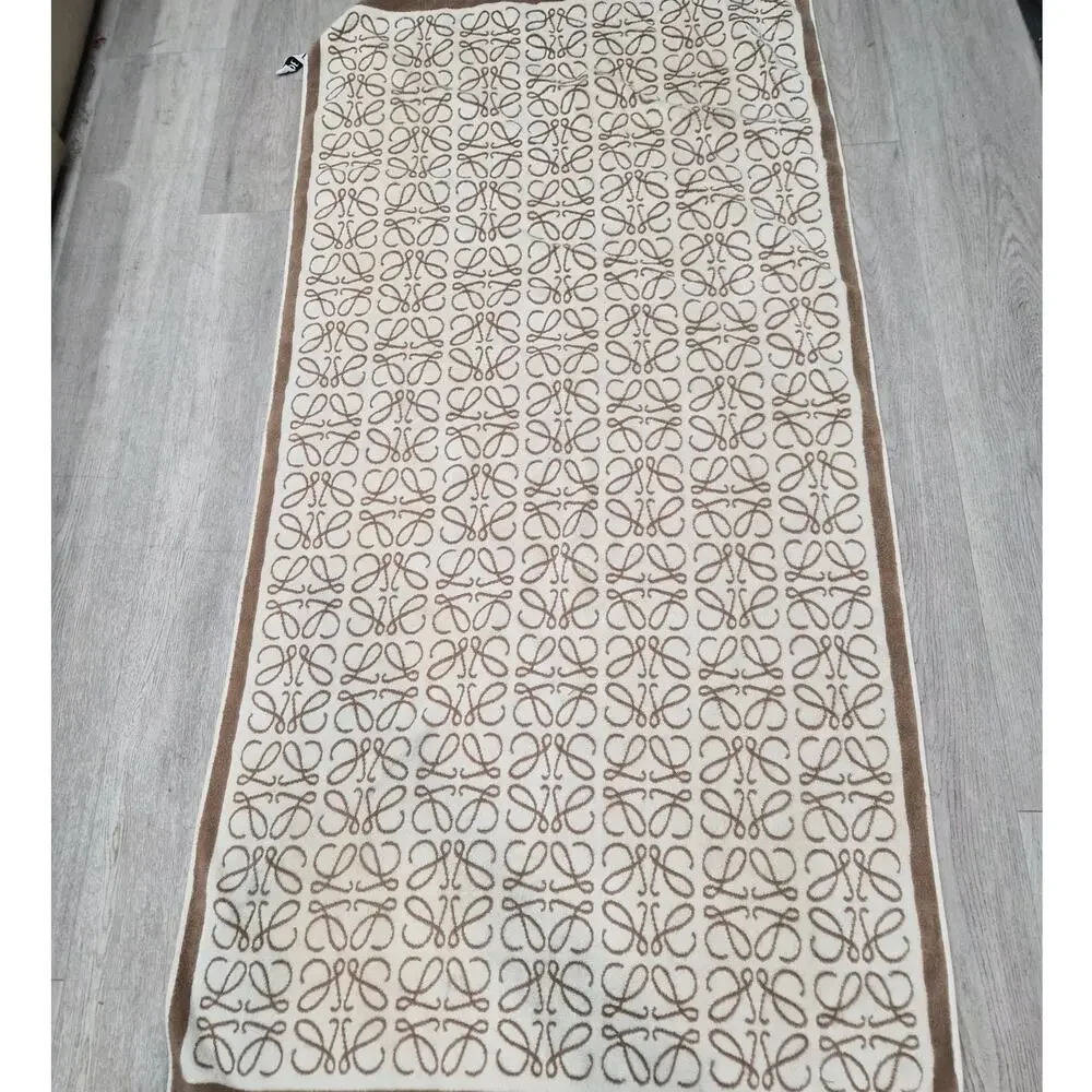 $750 Loewe Anagram towel in cotton